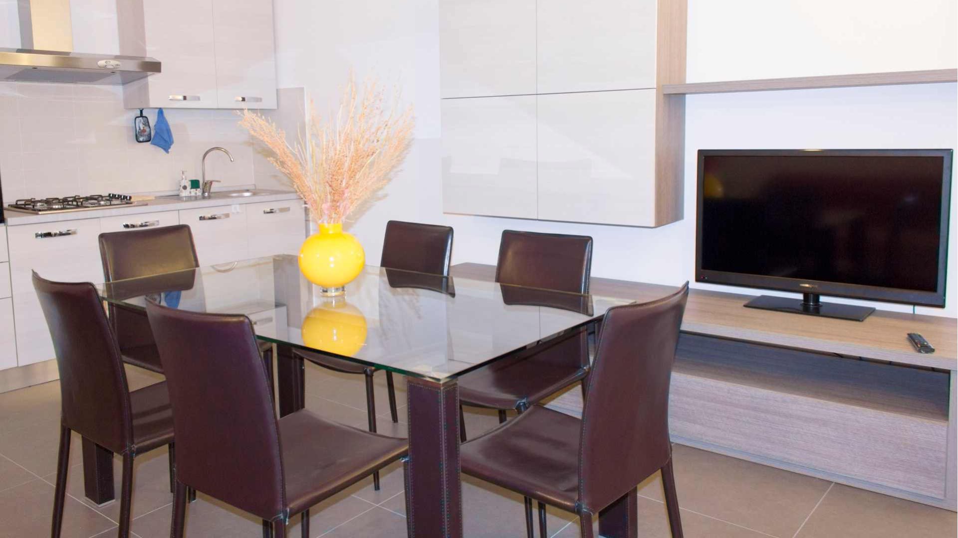 Zona Cucina - living con divano letto